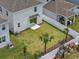 Aerial view of backyard, with green grass, privacy fence and small palm trees at 1162 Happy Forest Loop, Deland, FL 32720