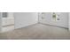 Spacious bedroom with carpet floors, two windows and an ensuite bathroom at 1162 Happy Forest Loop, Deland, FL 32720