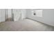 A spacious and carpeted area with natural lighting coming in through the window at 1162 Happy Forest Loop, Deland, FL 32720