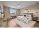 Spacious main bedroom with large bed and wood floors at 12983 Westside Village Loop, Windermere, FL 34786