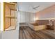 Modern bedroom with wood-look floors and built-in shelving at 12983 Westside Village Loop, Windermere, FL 34786