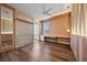 Stylish bedroom with built-in desk and wood floors at 12983 Westside Village Loop, Windermere, FL 34786