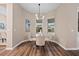 Bright breakfast nook with a glass table and four beige chairs at 12983 Westside Village Loop, Windermere, FL 34786