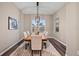 Bright dining room with wood floor and modern light fixture at 12983 Westside Village Loop, Windermere, FL 34786