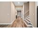 Bright and airy entryway with stairs and wood-look flooring at 12983 Westside Village Loop, Windermere, FL 34786