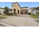 Two-story house with a brick driveway and well-manicured landscaping at 12983 Westside Village Loop, Windermere, FL 34786