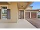 Inviting house exterior featuring a two-car garage and a covered entryway at 12983 Westside Village Loop, Windermere, FL 34786