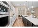 Modern kitchen with an island, white cabinets, and stainless steel appliances at 12983 Westside Village Loop, Windermere, FL 34786