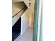 Inviting entryway with black stairs, tile flooring, and a freshly painted blue door at 3660 Wilshire Way Rd # 260, Orlando, FL 32829