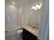 Clean bathroom with a white tub, granite vanity, and a mirror at 1200 Bear Oak Ln, Deland, FL 32720