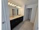 Elegant bathroom with dark brown vanity and granite countertop at 1200 Bear Oak Ln, Deland, FL 32720