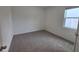 Simple bedroom with grey carpet and a window with blinds at 1200 Bear Oak Ln, Deland, FL 32720