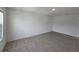 Spacious bedroom with neutral carpeting and large window at 1200 Bear Oak Ln, Deland, FL 32720