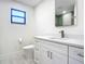 Contemporary bathroom featuring a vanity with quartz countertop and modern fixtures at 2239 River Ridge Rd, Deland, FL 32720