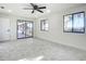 Bedroom features natural light, ceiling fan, and a glass sliding door at 2239 River Ridge Rd, Deland, FL 32720