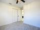 Clean bedroom featuring a ceiling fan, tiled floors, and closet at 2239 River Ridge Rd, Deland, FL 32720
