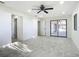 Bedroom features sliding door, a ceiling fan, and plenty of natural light at 2239 River Ridge Rd, Deland, FL 32720
