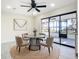 Bright breakfast nook features lake views, modern light fixtures, and seating for four people at 2239 River Ridge Rd, Deland, FL 32720