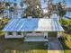 Charming single-story home with a metal roof and access to a serene lake at 2239 River Ridge Rd, Deland, FL 32720
