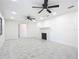Spacious living room with a fireplace, two ceiling fans, and recessed lighting at 2239 River Ridge Rd, Deland, FL 32720