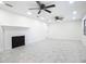 Spacious living room featuring a brick fireplace, two ceiling fans, and recessed lighting at 2239 River Ridge Rd, Deland, FL 32720