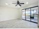 Living room features a glass sliding door providing outdoor views at 2239 River Ridge Rd, Deland, FL 32720