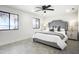 Bright main bedroom features windows with lake views, bedside tables and modern lamps at 2239 River Ridge Rd, Deland, FL 32720