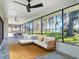Bright sunroom with panoramic windows, stylish furniture, and expansive outdoor views at 2239 River Ridge Rd, Deland, FL 32720