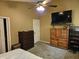 Spacious bedroom with ceiling fan, TV, and ample closet space for storage, blending comfort with practicality at 328 Sterling Rose Ct, Apopka, FL 32703