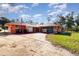 Home's exterior showcasing a carport and a spacious yard at 4028 Wendy Dr, Orlando, FL 32808