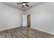 Bedroom with wood-look floors and access to a bathroom at 541 Willet Cir, Auburndale, FL 33823