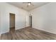 Bedroom with wood-look floors and a spacious closet at 541 Willet Cir, Auburndale, FL 33823