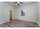 Bright bedroom with wood-look flooring and a walk-in closet at 541 Willet Cir, Auburndale, FL 33823