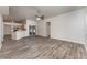 Open concept living room with kitchen and sliding glass doors at 541 Willet Cir, Auburndale, FL 33823