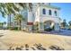 Elegant building with porte-cochere and well-maintained landscaping for a luxurious arrival experience at 7383 Universal Blvd # 512, Orlando, FL 32819