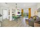 Inviting living room with modern decor, a dining area, and sliding doors to a private balcony at 7383 Universal Blvd # 512, Orlando, FL 32819