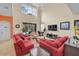 Bright living room boasting high ceilings, large windows, and comfortable seating for Gathering and guests at 2948 Banana Palm Dr, Kissimmee, FL 34747