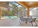 Screened-in patio features a private in-ground pool and hot tub perfect for relaxation at 2948 Banana Palm Dr, Kissimmee, FL 34747