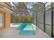 Inviting screened-in pool and spa offers a refreshing escape with a private backyard view at 2948 Banana Palm Dr, Kissimmee, FL 34747