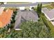An aerial view showcasing a home's backyard, pool, and surrounding landscape at 349 Plantation Club Dr, Debary, FL 32713