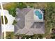 Aerial view of a home featuring a private pool area and well-maintained landscaping, perfect for outdoor living at 349 Plantation Club Dr, Debary, FL 32713