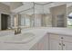 Bright bathroom features a sink with a stylish faucet, large mirrors, and good lighting at 349 Plantation Club Dr, Debary, FL 32713