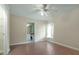 Bedroom featuring modern flooring, ceiling fan, and a view of the bathroom at 349 Plantation Club Dr, Debary, FL 32713