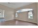 Bedroom with wood floors, neutral walls, and large windows at 349 Plantation Club Dr, Debary, FL 32713