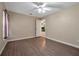 Well-lit bedroom with wood floors and a ceiling fan at 349 Plantation Club Dr, Debary, FL 32713