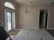 Bright dining room with tile floors, a chandelier, and French doors leading to the outdoor pool at 349 Plantation Club Dr, Debary, FL 32713
