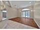 Bright living area featuring beautiful hardwood floors and French doors to the outdoor patio at 349 Plantation Club Dr, Debary, FL 32713