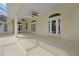 Expansive covered patio with multiple access points, providing ample space for outdoor entertainment at 349 Plantation Club Dr, Debary, FL 32713