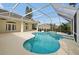 A sparkling in-ground pool, surrounded by a screened enclosure, provides a serene outdoor oasis at 349 Plantation Club Dr, Debary, FL 32713