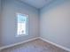 Bedroom with neutral carpet and a window overlooking exterior at 7760 Sandy Ridge Dr # 222, Kissimmee, FL 34747